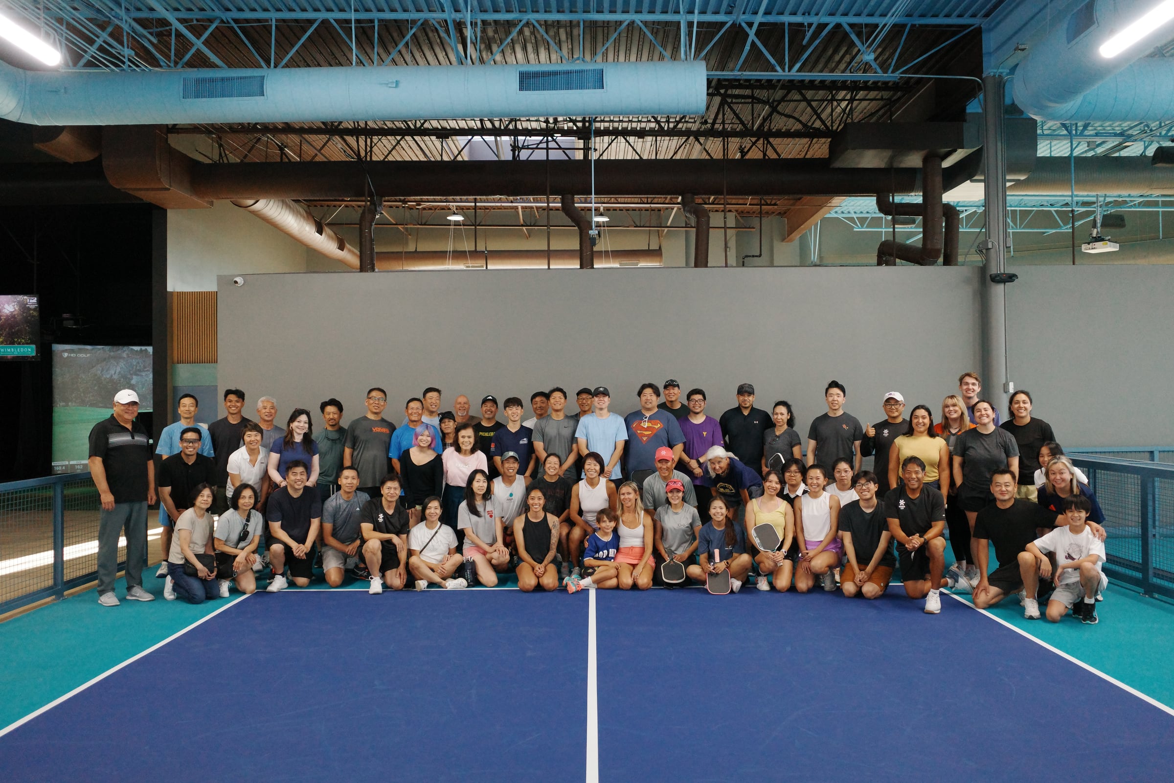 Large group event on the pickleball courts at GamePoint